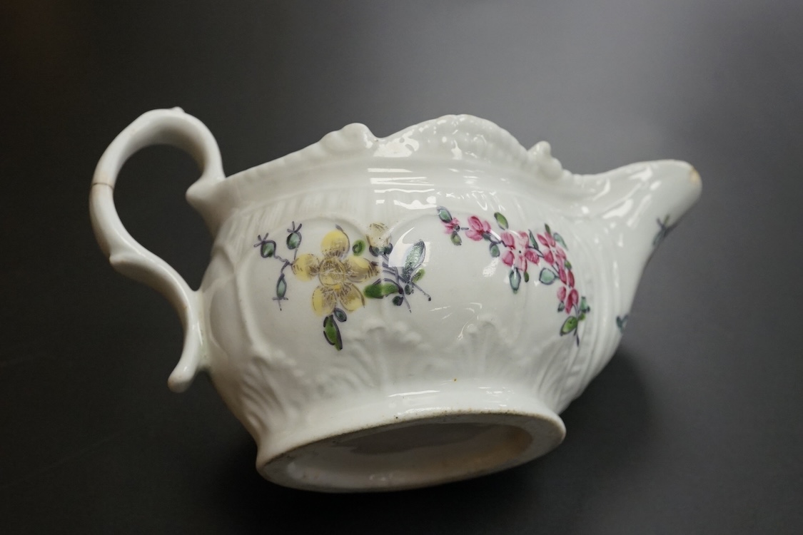 A Liverpool porcelain sauceboat, handpainted with flowers, circa 1760, 14cm wide